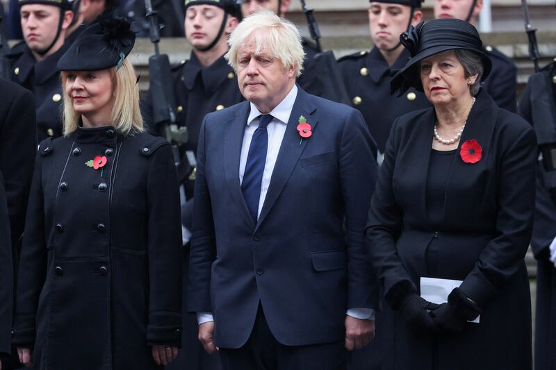 Ms May with fellow former prime ministers Liz Truss and Boris Johnson during the National Service of Remembrance at The Cenotaph in November 2023 in London