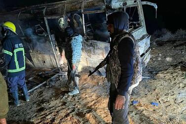 The scene of an attack targeting a bus transporting Syrian regime soldiers as they travelled home for holidays in the eastern province of Deir Ezzor on December 30, 2020. Sana / AFP