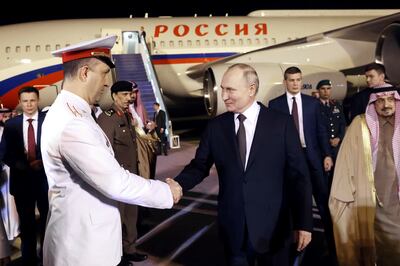Russian President Vladimir Putin shakes hands with an officer upon his arrival in Riyadh on Wednesday. AP