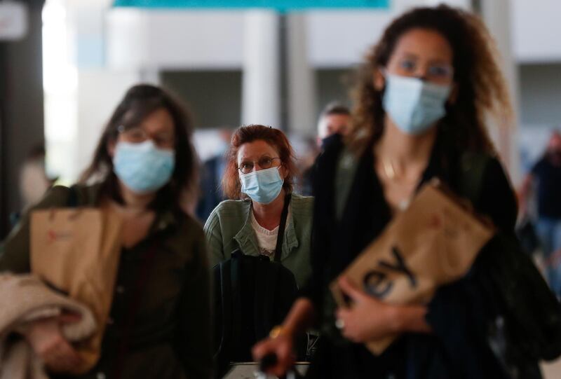 People arrive at Faro Airport from Manchester on the first day that Britons are allowed to enter Portugal without needing to quarantine. Reuters