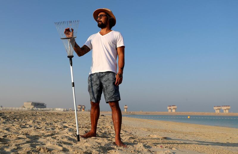 Dubai, United Arab Emirates - Reporter: N/A. Features. Sand artist Nathaniel Alapide draws murals on the beach using a rake in Jebel Ali. Tuesday, November 3rd, 2020. Dubai. Chris Whiteoak / The National

Please don't use for a standalone planned feature for early December