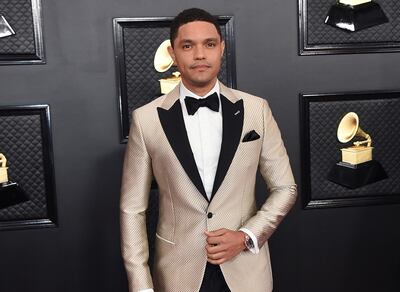 FILE - Trevor Noah arrives at the 62nd annual Grammy Awards in Los Angeles on Jan. 26, 2020. Noah has been tapped to host the 2021 Grammy Awards. The Recording Academy made the announcement hours before the nominees for the 2021 show would be revealed. It would mark Noah's first time hosting the Grammys. (Photo by Jordan Strauss/Invision/AP, File)