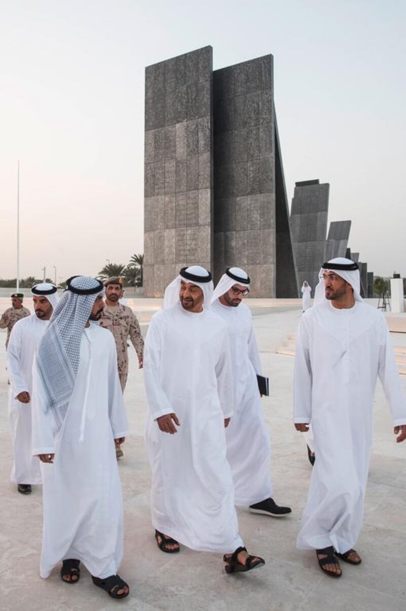 Sheikh Mohammed speaks with Sheikh Khalifa bin Tahnoon while visiting Wahat Al Karama. Seen with Mohammed Al Mazrouei. Ryan Carter / Crown Prince Court — Abu Dhabi