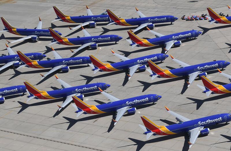 (FILES) In this file photo taken on March 28, 2019 Southwest Airlines Boeing 737 MAX aircraft are parked on the tarmac after being grounded, at the Southern California Logistics Airport in Victorville, California. Boeing reported lower first-quarter profits on April 24, 2019, as the global grounding of its 737 MAX plane following two crashes hit results. The US aerospace giant reported $2.1 billion in profits, down 13.2 percent from same period a year ago. Boeing also withdrew its full-year profit forecast due to uncertainty surrounding the 737 MAX. / AFP / Mark RALSTON
