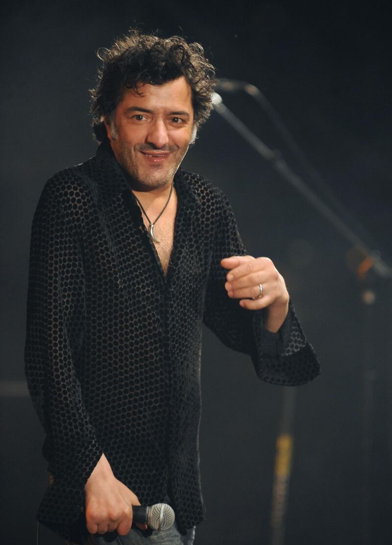 (FILES) In this file photo taken on June 21, 2009 Algerian singer Rachid Taha performs, on June 21, 2009 in Toulouse, southwestern France for the 15th edition of the Rio Loco festival, which is dedicated this year to North African Maghreb music. - Singer Rachid Taha died of a heart attack, at the age of 59, in the night from September 11 to September 12, 2018 announced his family. (Photo by REMY GABALDA / AFP)