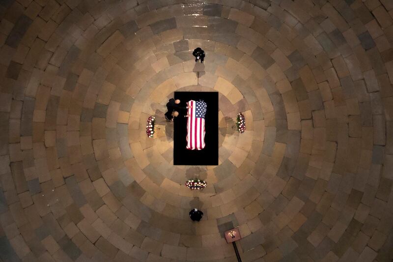 Democratic presidential candidate Joe Biden and his wife Jill Biden touch the flag-draped casket of the late House Representative John Lewis, as he lies in state at the Capitol in Washington. AP Photo