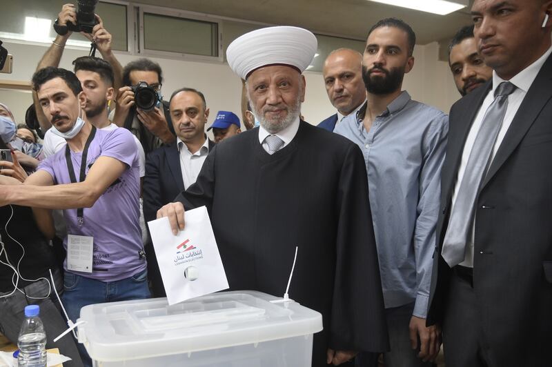 Sheikh Abdul Latif Derian, Grand Mufti of Lebanon, casts his ballot paper during parliamentary elections in Beirut. EPA