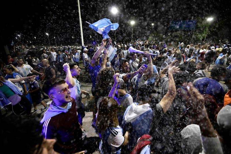 Supporters await the arrival of the World Cup-winning Argentina squad at the Football Association headquarters. AFP