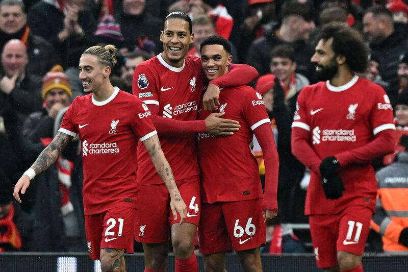 Liverpool's Trent Alexander-Arnold, second right, celebrates with teammates after scoring. AFP