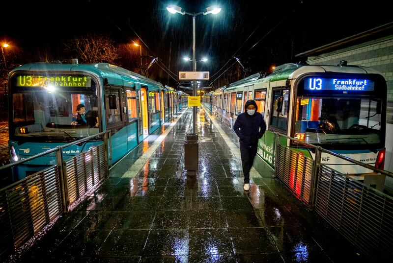 A man wearing a face mask walks through a subway station in Oberursel near Frankfurt, Germany. Numbers of infections in Germany are rising again. AP Photo