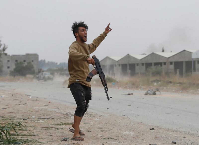 A GNA fighter gestures in the open. Reuters