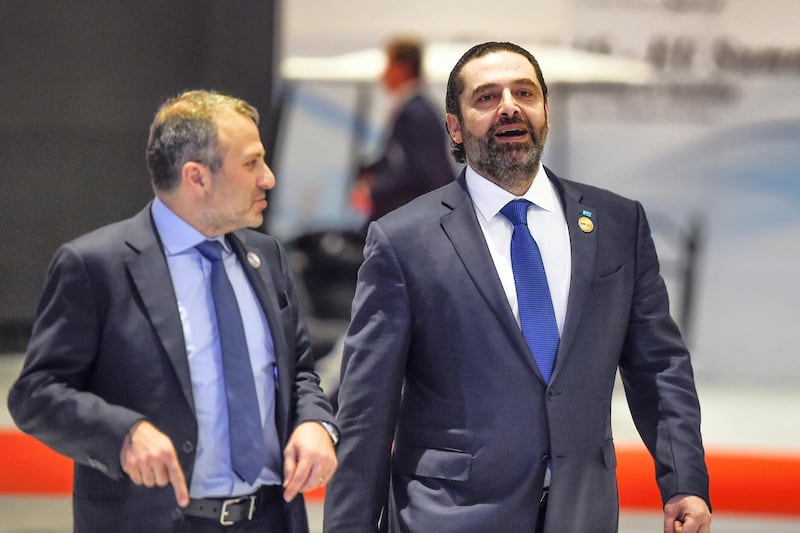 Lebanese Prime Minister Saad Hariri (R) along with Foreign Minister Gebran Bassil arrive to the International Congress Centre on February 24, 2019, ahead of first joint European Union and Arab League summit in the Egyptian Red Sea resort of Sharm el-Sheikh. (Photo by MOHAMED EL-SHAHED / AFP)