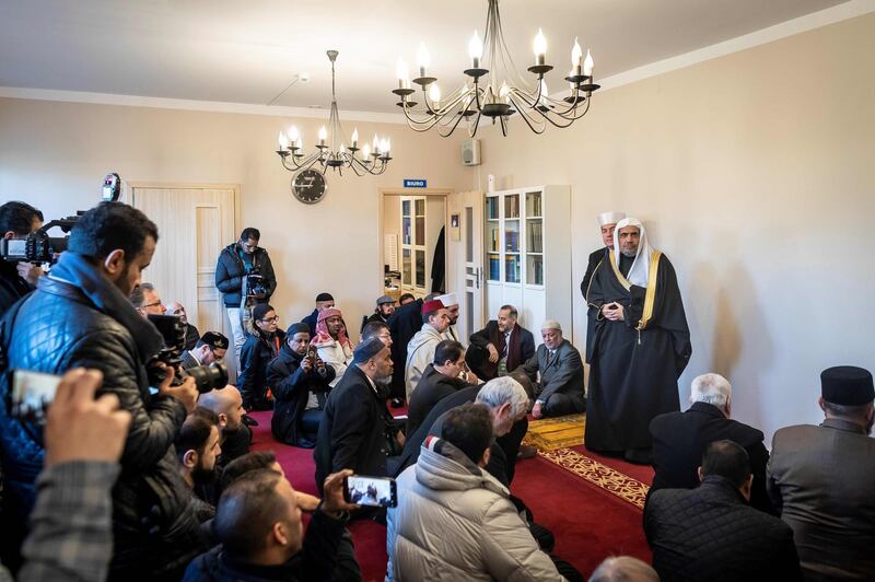 Mohammad Abdulkarim Al Issa speaks next to Mufti of Poland Tomasz Miskiewicz during a visit at a mosque in Warsaw. AFP