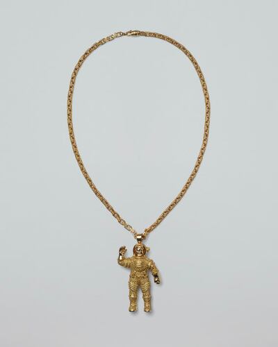 A gold astronaut pendant, now offered for $56,000, by Jacob & Co. Made for Pharrell Williams, he wore it to the Versace spring 2004 haute couture show. Photo: Joopiter