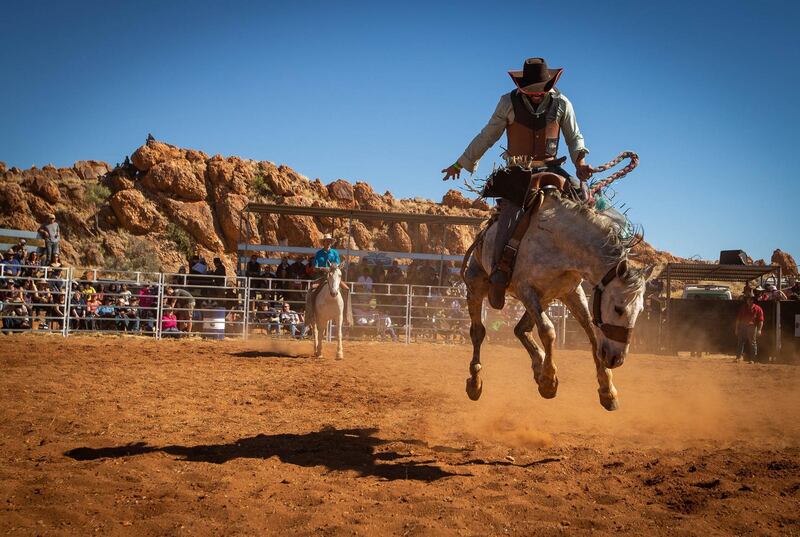 Les 'Hollywood' McLoughlin competes during the Open Saddle Bronc ride at the Harts Range Races and Rodeo. EPA