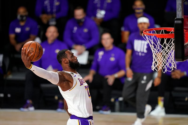 Los Angeles Lakers' LeBron James dunks during the first half in Game 6 of the NBA Finals match against the Miami Heat on Sunday, October 11, 2020, in Lake Buena Vista, Florida. AP