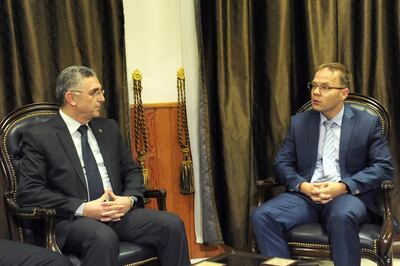 Syria's Minister of National Reconciliation Affairs Ali Haidar meets with Christian Blex, a regional AfD lawmaker, in Syria March 6, 2018. Picture taken March 6, 2018. SANA/Handout via REUTERS ATTENTION EDITORS - THIS PICTURE WAS PROVIDED BY A THIRD PARTY. REUTERS IS UNABLE TO INDEPENDENTLY VERIFY THE AUTHENTICITY, CONTENT, LOCATION OR DATE OF THIS IMAGE