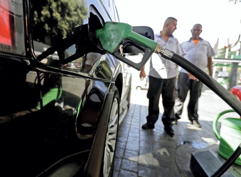 A driver fills his tank at a petrol station in the Lebanese capital Beirut on September 27, 2019. - Lebanon's gas station owners suspended today a strike over a feared shortage in dollar reserves, pending a meeting with the prime minister later in the afternoon. The Syndicate of Gas Station Owners on September 26  night announced an open-ended strike, saying banks were not supplying them with the dollars they need to pay importers and suppliers because of a shortage in reserves. (Photo by JOSEPH EID / AFP)