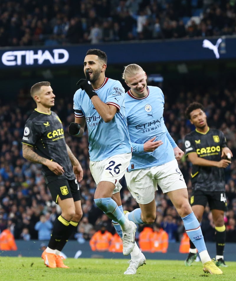 City's Riyad Mahrez celebrates with Erling Haaland (R) after scoring. EPA