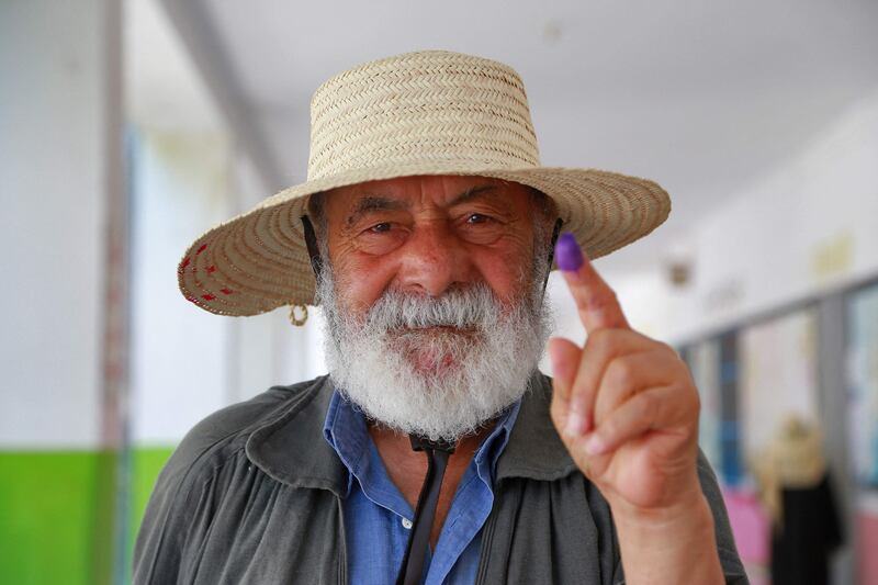 A Tunisian man votes during the referendum at a polling station in the Ben Arous region near Tunis. AFP