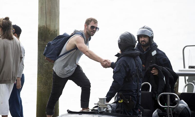 Family member thanks the Police National Dive Squad near White Island in Whakatane, New Zealand. Getty Images