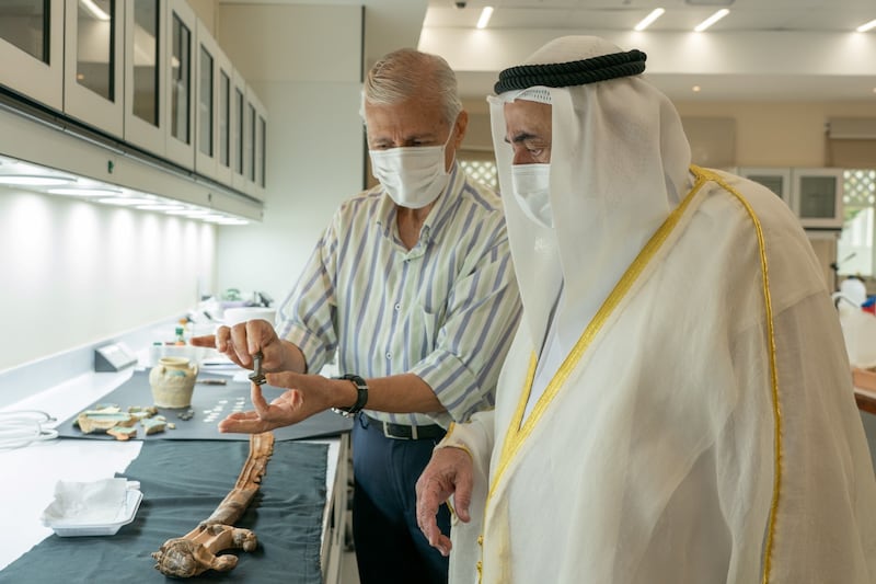 Sheikh Dr Sultan is shown a priceless Roman key found by archaeologists.