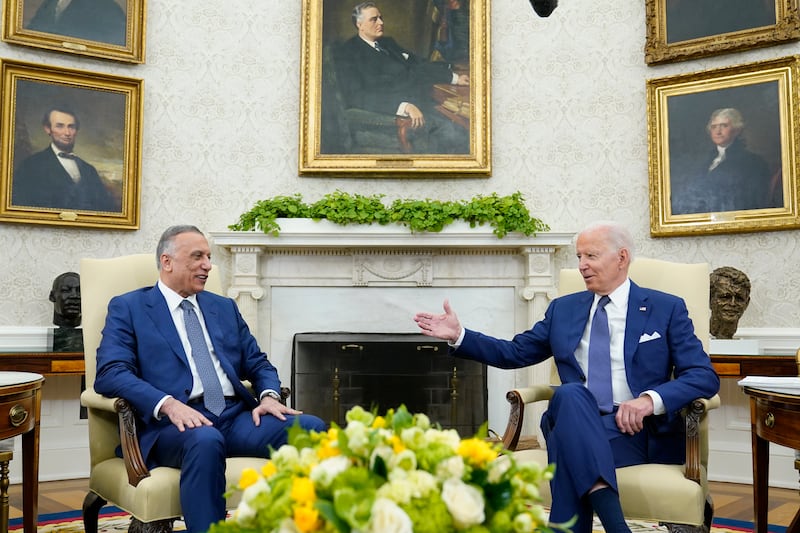 Iraqi Prime Minister Mustafa Al Kadhimi and US President Joe Biden during their meeting in the Oval Office of the White House in Washington on Monday. AP