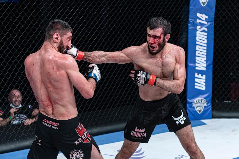 A bloodied Russian Islam Mamedov lands one on Martun Mezhulmyan of Armenia but the latter went on to win the Catchweight 73kg fight. Courtesy Palms Sports