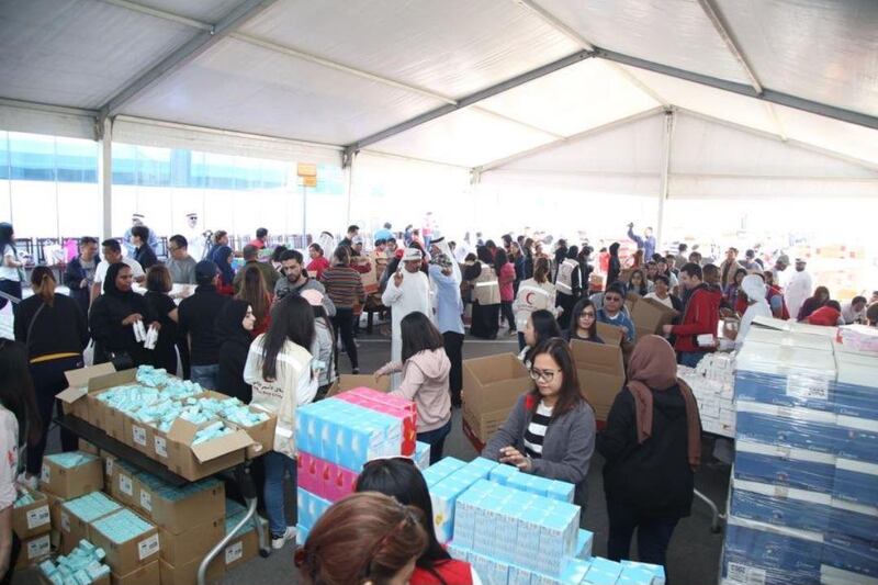 Volunteers pack boxes filled with essentials to be sent to the Philippines. Filipinos living close to the Taal volcano had to flee their homes as it continued to be active at the weekend. Courtesy: Dubai Media Office