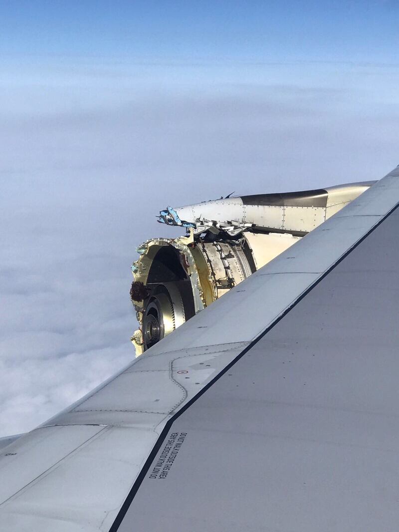 This handout picture released on September 30, 2017 on the twitter account of @Bdaddy1391 shows the damaged engine of an Air France A380 superjumbo before it made an emergency landing in Canada.
An Air France A380 superjumbo carrying more than 500 people made an emergency landing in Canada after suffering "serious damage" to one of its engines, with passengers recounting hearing a loud bang followed by violent shaking. / AFP PHOTO / TWITTER / Sarah Eamigh