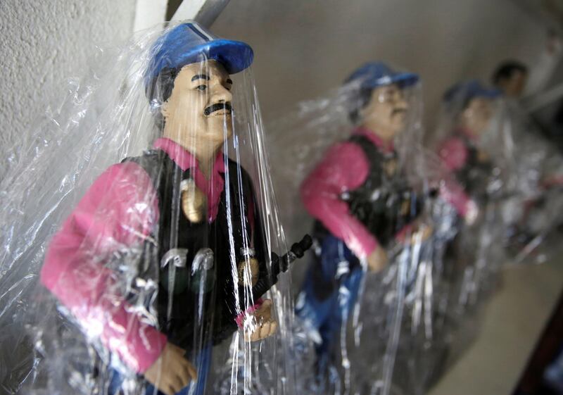 Souvenirs of Joaquin 'El Chapo' Guzman are pictured in a store at the 'Saint Jesus Malverde' chapel in Culiacan, in Mexico's state of Sinaloa. Reuters