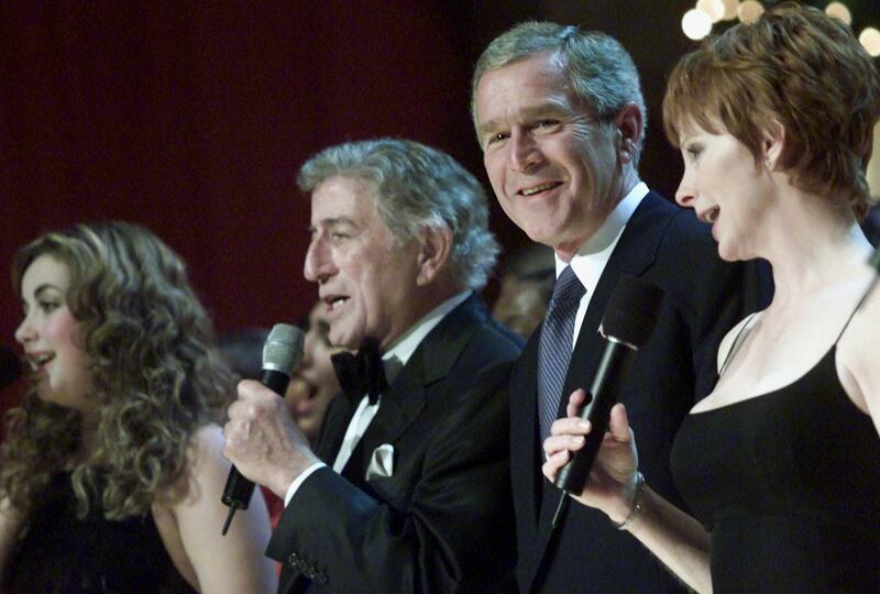 From left, British singer Charlotte Church, Tony Bennett, former US President George W Bush and Reba McEntire at the National Building Museum in Washington, December 2001. Reuters