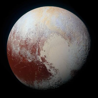 NASAâ€™s New Horizons spacecraft captured this high-resolution enhanced color view of Pluto on July 14, 2015. The image combines blue, red and infrared images taken by the Ralph/Multispectral Visual Imaging Camera (MVIC). Plutoâ€™s surface sports a remarkable range of subtle colors, enhanced in this view to a rainbow of pale blues, yellows, oranges, and deep reds. Many landforms have their own distinct colors, telling a complex geological and climatological story that scientists have only just begun to decode. The image resolves details and colors on scales as small as 0.8 miles (1.3 kilometers).  The viewer is encouraged to zoom in on the full resolution image on a larger screen to fully appreciate the complexity of Plutoâ€™s surface features. Credit: NASA/JHUAPL/SwRI