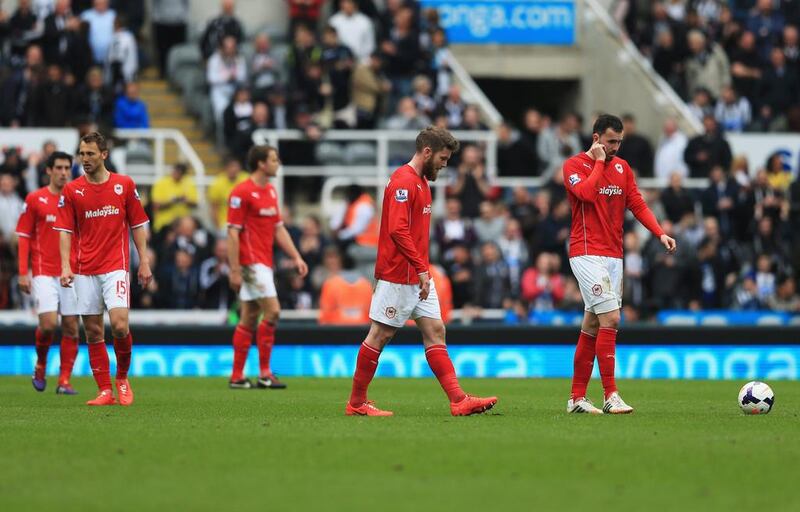 Aron Gunnarsson, second from right, and Jordon Mutch of Cardiff City, right, look dejected during the English Premier League against Newcastle United. Matthew Lewis / Getty Images