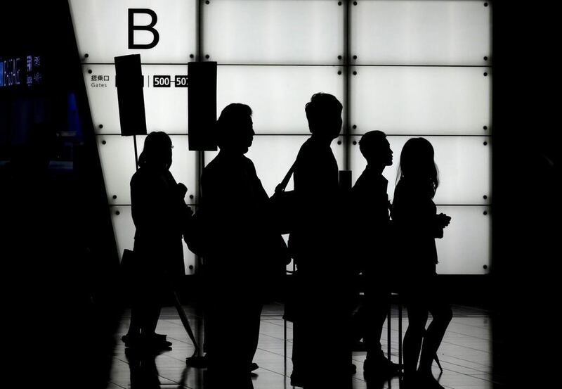 Passengers queue for security check at a departure gate at the domestic terminal of Tokyo International Airport at Haneda in Tokyo, Japan. Typhoon Malakas landed on the Japanese southwestern island of Kyushu and is hitting though Japanese islands from west to east. The typhoon has forced the cancellation of over 100 flights. Kimimasa Mayama / EPA