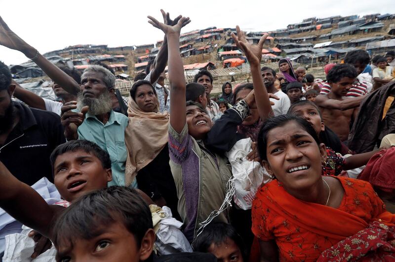 Aid is distributed to Rohingya refugees after their arrival at Coxs Bazar, Bangladesh September 18, 2017. REUTERS/Cathal McNaughton