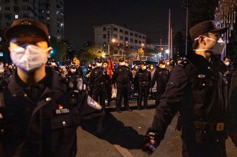 Police form a chain at Beijing protests. Demonstrations have also been reported in cities including, Shanghai, Nanjing, Chengdu, Lanzhou, Guangzhou and Wuhan – where Covid-19 was first reported. Bloomberg