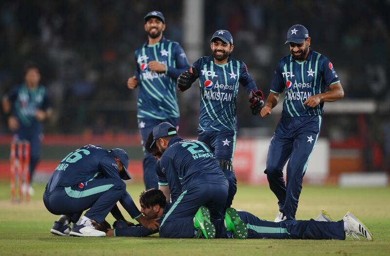 Usman Qadir of Pakistan is congratulated by teammates after taking the catch that dismissed Alex Hales. Getty