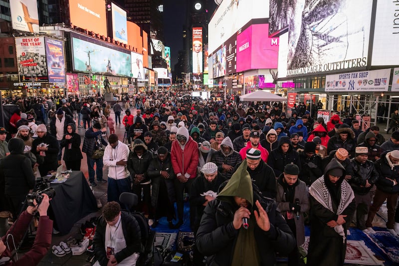 Members of the Muslim community gather for the Taraweeh prayer during a month of Ramadan at New York's Times Square, Sunday, March 10, 2024.  (AP Photo / Yuki Iwamura)