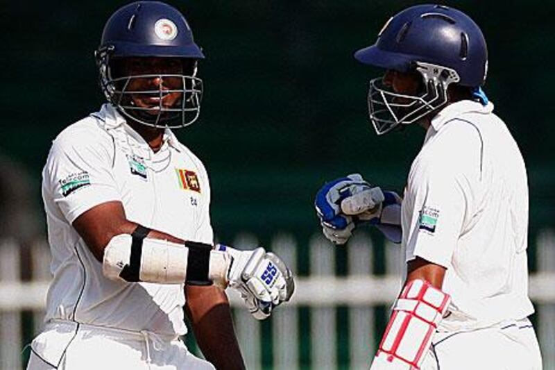 Kumar Sangakkara, left, and the Sri Lanka captain, Tillakaratne Dilshan, have made light work of batting in Sharjah today.