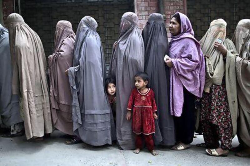 Pakistani women queue at a polling station on the outskirts of Islamabad. Muhammed Muheisen / AP Photo