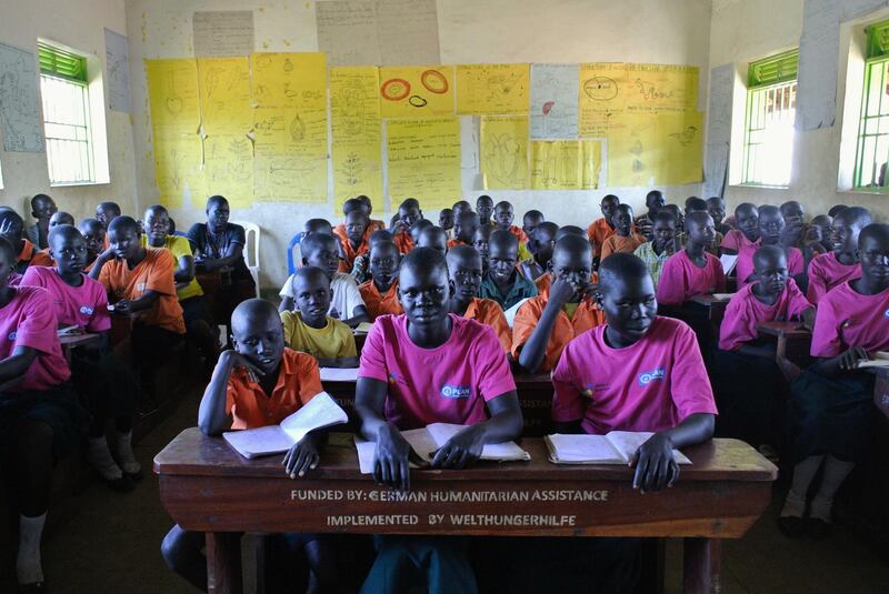 ADJUMANI DISTRICT, Uganda, Tuesday, November 28, 2017 // South Sudanese students at Liberty Primary School wait to meet with the Dubai Cares delegation to the Ayilo II refugee settlement in Northern Uganda Tuesday, Nov. 28, 2017. Dubai Cares partnered with Plan International to build new classrooms at the school for South Sudanese refugees. (Roberta Pennington/The National)