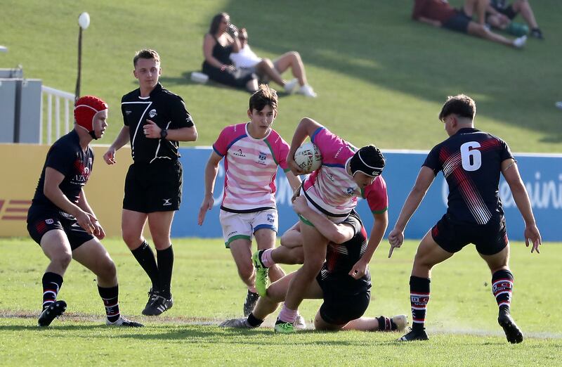 Players in action during the Gulf Under 19 boys cup semi-final 1 match between Dubai College (black) vs S22 UAE Academy.