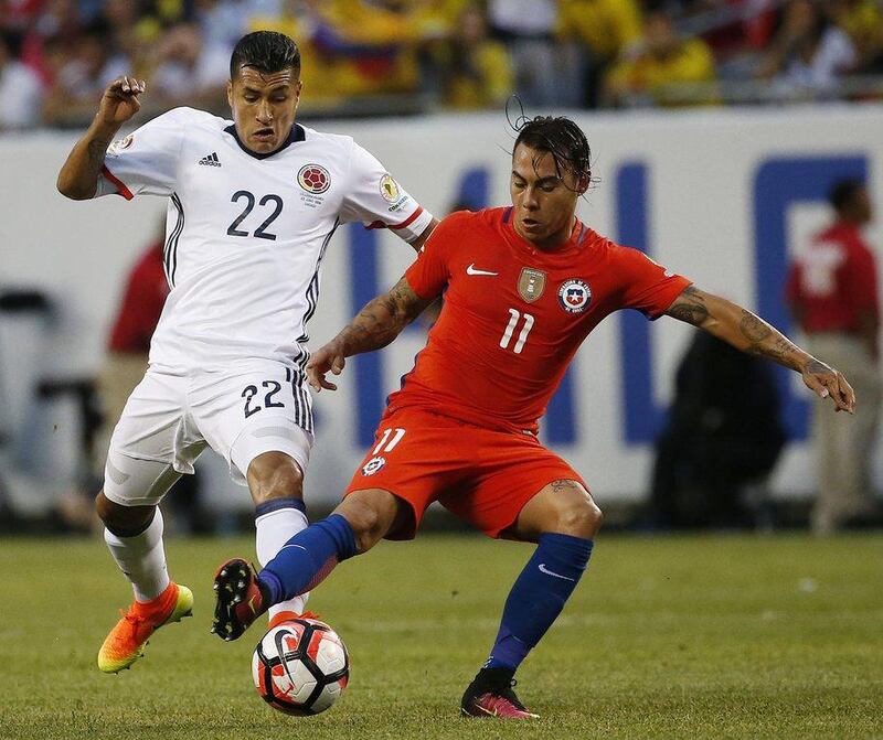 Colombia's Jeison Murillo (22) and Chile's Eduardo Vargas (11) vie for the ball during a Copa America Centenario semifinal soccer match at Soldier Field in Chicago, Wednesday, June 22, 2016. (AP Photo/Nam Y. Huh)