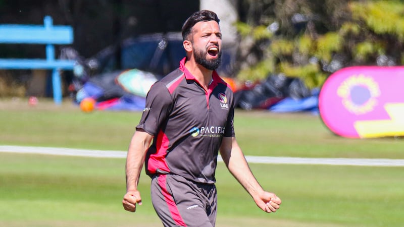 UAE bowler Rohan Mustafa celebrates taking the wicket of Chris Greaves for 26.