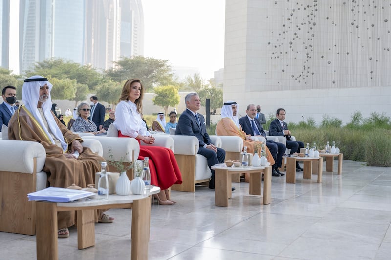 Queen Rania, in a red wool-crepe midi skirt by Emilia Wickstead paired with a white shirt, at the ceremony for the Zayed Award For Human Fraternity on February 26, 2022, at The Founder's Memorial in Abu Dhabi. Photo: Hamad Al Kaabi  / Ministry of Presidential Affairs