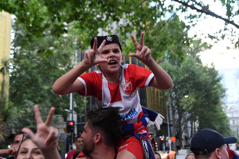 Members of the local Serbian community play music and dance outside the legal offices where Serbia's tennis champion Novak Djokovic is in with his legal team in Melbourne. AFP