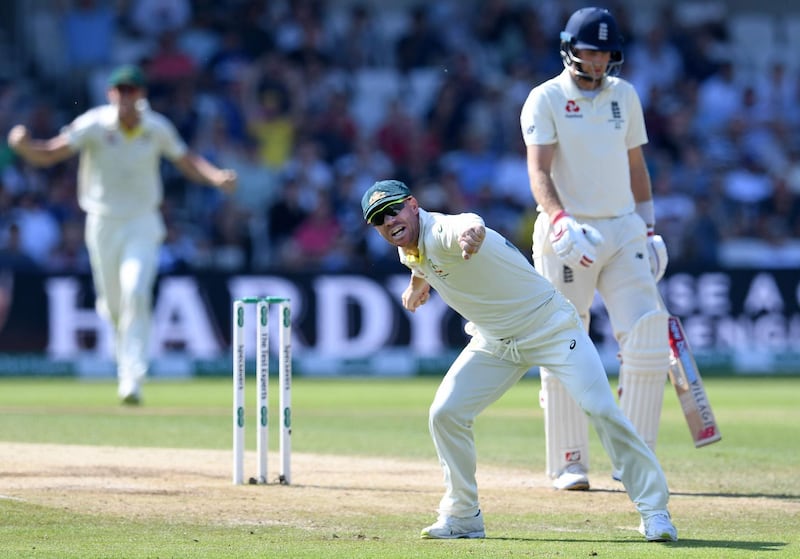 Australia's David Warner celebrates taking the wicket of England captain Joe Root for 77 runs. AFP