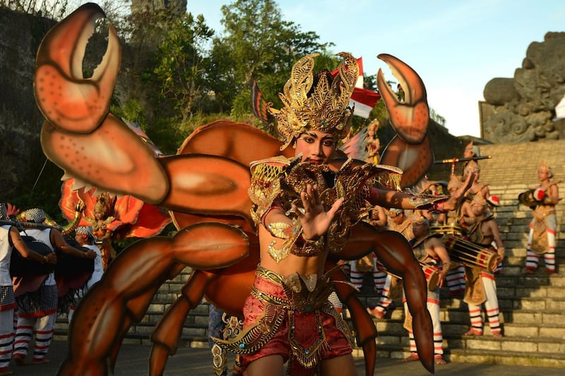Aa man performing a traditional dance during a parade at Garuda Wisnu Kencana in Jimbaran on Indonesia's resort island of Bali. Sonny Tumbelaka/AFP