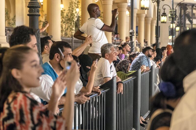 DUBAI, UNITED ARAB EMIRATES. 14 JULY 2018. Kpop Boyband EXO gets a LED light show on the Burj Khalifa. Fan’s gather to watch the show. (Photo: Antonie Robertson/The National) Journalist: Evelyn Lau. Section: National.